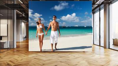 Couple on a beach at Maldives Wall mural