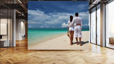 Couple on a beach at Maldives Wall mural