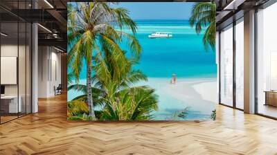 Three year old toddler boy on beach with mother. Summer family vacation at Maldives. Wall mural