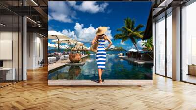 Woman sailor striped in dress near poolside Wall mural