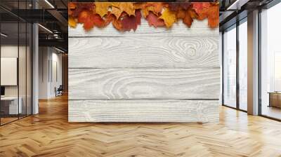 Wooden background with autumn leaves Wall mural