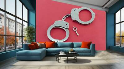 Handcuffs and key isolated Wall mural