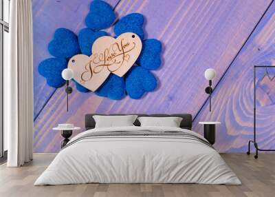 decor two wooden hearts with the inscription I love you in in blue hearts on a blue background. view from above. Valentine's day concept, anniversary, wedding Wall mural