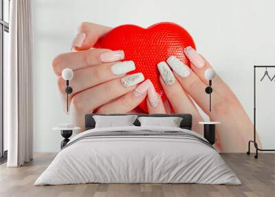 Love for manicure art concept. Beauty hands holding red heart shaped jewelry box. Stylish pastel Color pink coral white Nails isolated white background. Classic wedding bride nails design Nail Polish. Wall mural