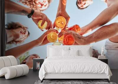 bottom view of group of happy young people clinking bottles of beer Wall mural