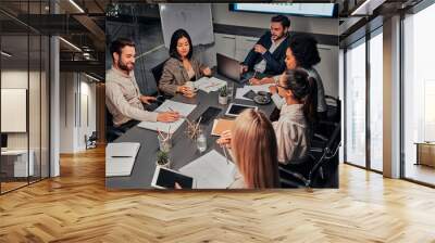 Business conference. A group of successful business people of different nationalities work together, discuss work. The concept of training, meeting, analysis, statistics. Wall mural