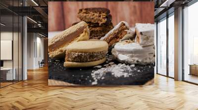 Three different types of the classic Argentinean alfajores filled with dulce de leche. Traditional food. Wall mural