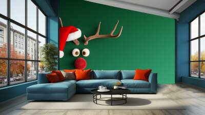 Reindeer with red nose and Santa hat on green Christmas background 3D Rendering, 3D Illustration Wall mural