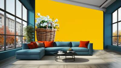 White flowers in wooden basket on yellow spring background 3D Rendering Wall mural