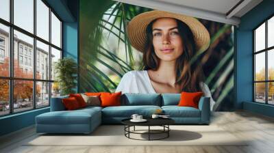 Beautiful woman wearing straw hat and white T-Shirt, background of tropical oasis Wall mural