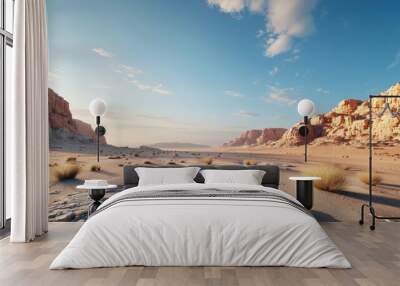 Stunning desert landscape with rocky formations, sparse vegetation, and a clear blue sky. A serene and mesmerizing natural view. Wall mural