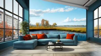 Vibrant landscape featuring serene lake, lush grasses, and bright skies. Perfect for nature themes and peaceful scenery. Wall mural