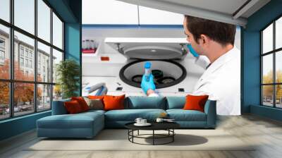 Laboratory technician using refrigerated centrifuge machine in blood bank, Benchtop Centrifuges, Device for laboratory research. Modern lab technologies. Medical Research Centrifuge. Wall mural