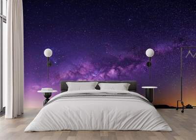 purple night sky half part milky way and star on dark background universe filled with stars nebula and galaxy with noise and grain photo by long exposure and select white balance Wall mural