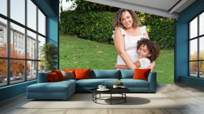 Portrait of a mother and daughter spending time together outdoors Wall mural