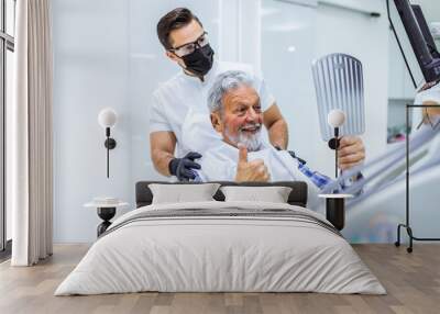 Senior man having dental treatment at dentist's office. Wall mural