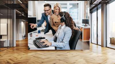 Team of call center employees working together on office. Wall mural