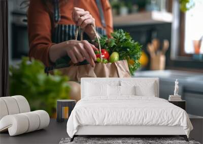  A brown paper bag with fresh fruits and vegetables on a white kitchen table Wall mural