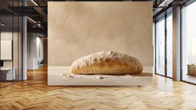 A ciabatta loaf on an isolated light beige background Wall mural