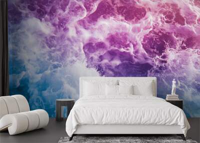 Abstract foam and water waves with pink, purple, and blue gradient colors. Dynamic ocean texture concept. Wall mural