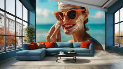 A woman wearing sunglasses applies sunscreen to her face to protect her skin from harmful UV rays. She is seen carefully rubbing the lotion onto her cheeks and forehead Wall mural