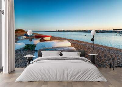 Dinghies on the beach at Bawdsley quay on the Suffolk coast Wall mural