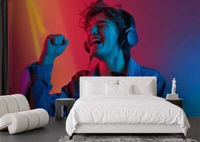 Enthusiastic Young Man Enjoying Music Wall mural