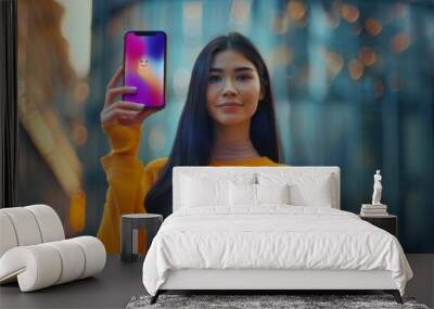 Young Woman Holding Smartphone Wall mural