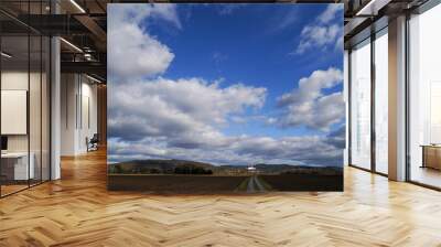 Clouds and landscape on a February afternoon in Bavaria Wall mural