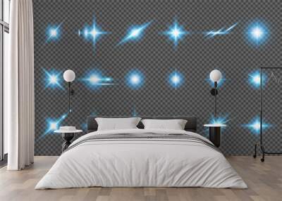 A set of glowing blue light effects on a transparent background. Sparkling and shining stars, bright flashes of lights with radiation. Vector illustration. Wall mural