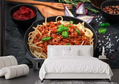 Classic Italian dish pasta bolognese on a black background. Top view, horizontal. Cooking concept. Wall mural