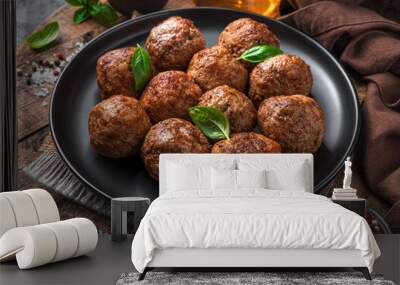 Fried meatballs with fresh herbs close-up on a wooden board. Wall mural