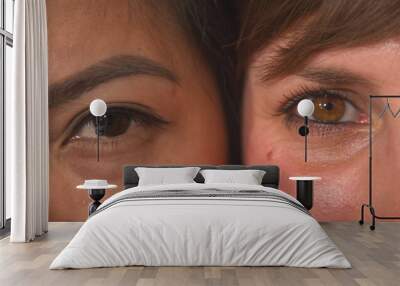 CLOSE UP, PORTRAIT: Detailed view of two young women's brown eyes side by side Wall mural