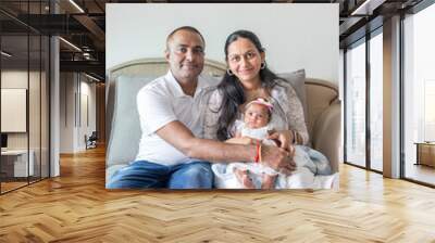 ndian family spending time together, wearing traditional and casual outfits with a baby, a young girl, and grandparents in a high-rise apartment in Kuala Lumpur, Malaysia. Wall mural