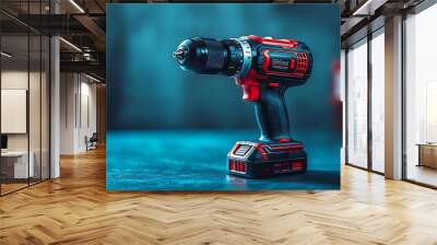 A black and red cordless drill with a blue background. Wall mural