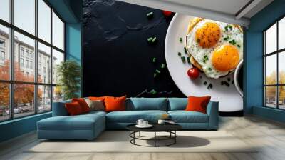 A breakfast of two fried eggs with chives and a side of coffee on a white plate. Wall mural