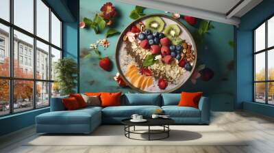 A colorful and healthy smoothie bowl with fresh fruit, granola, and nuts. Wall mural