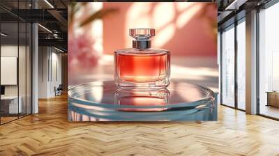 A glass bottle of perfume with a red liquid sits on a glass pedestal. Wall mural