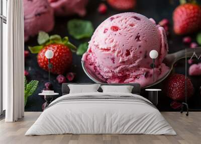 A scoop of pink strawberry ice cream with fresh strawberries and pomegranate seeds on a black background. Wall mural