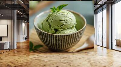 Green tea ice cream scoops in a ceramic bowl. Wall mural