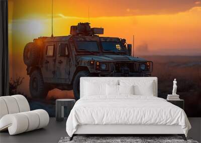 Military vehicle driving on a dirt road during sunset. Wall mural