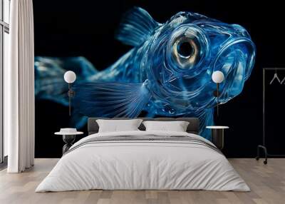 Transparent blue fish with a large eye and a black background. Wall mural