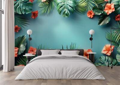 Tropical leaves and flowers frame a blank blue background. Wall mural