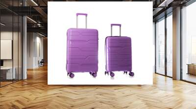 Set of polypropylene purple suitcases on a white background, isolate, close-up Wall mural