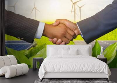 Partnership handshake between two professionals symbolizing ESG principles and a commitment to renewable energy and sustainable development. Business ethics concept Wall mural