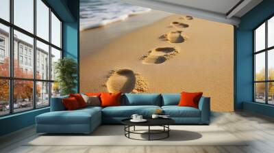 A single line of footprints leading across the serene sandy beach creating a minimalist and peaceful visual with ample copy space for text overlay or design element Wall mural