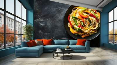 Delicious noodle stir fry dish with a variety of colorful fresh vegetables creating a vibrant and appetizing culinary scene with blank space for adding text or a message Wall mural