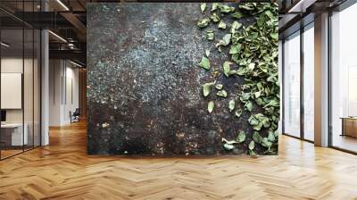 Macro photography showcasing the intricate details and textures of dried oregano leaves scattered across a rustic natural surface providing ample space for overlay text or design elements Wall mural