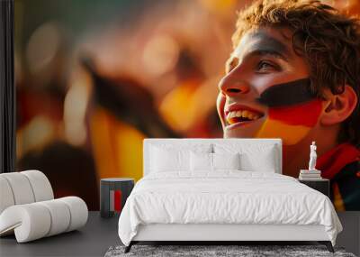 Male soccer supporter with the German national colors painted on his face. Concept of supporting a team and excitement for the sport. Wall mural