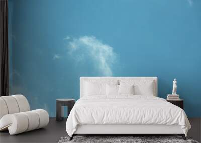 Fluffy clouds cover the summer blue sky Wall mural